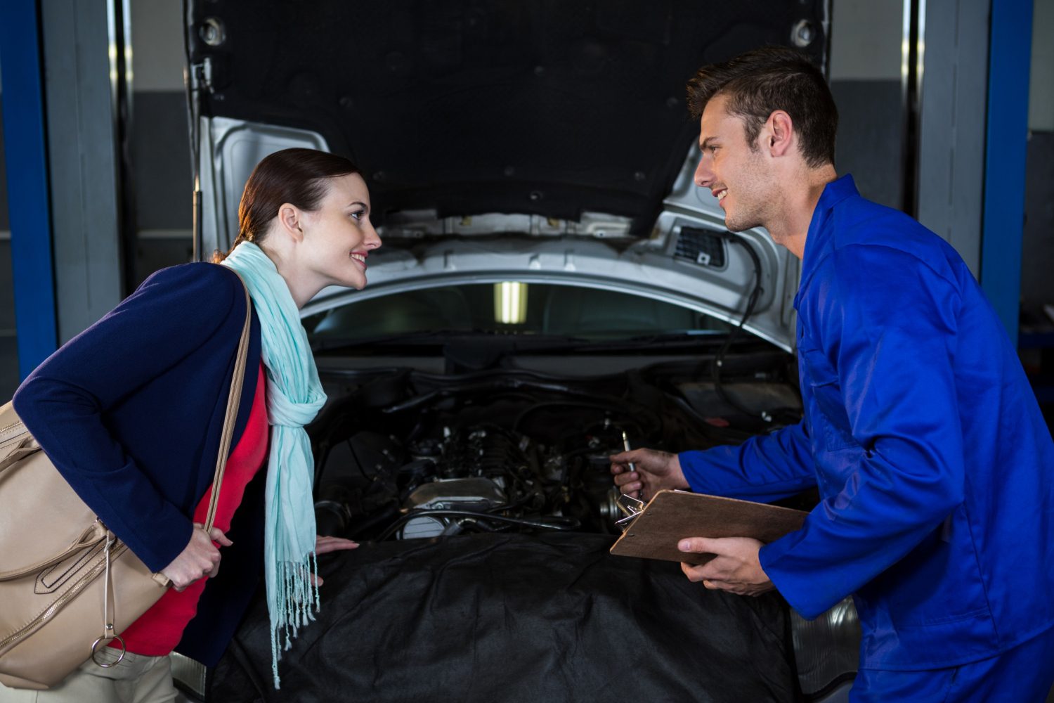 Mechanic explaining quotation to a customer